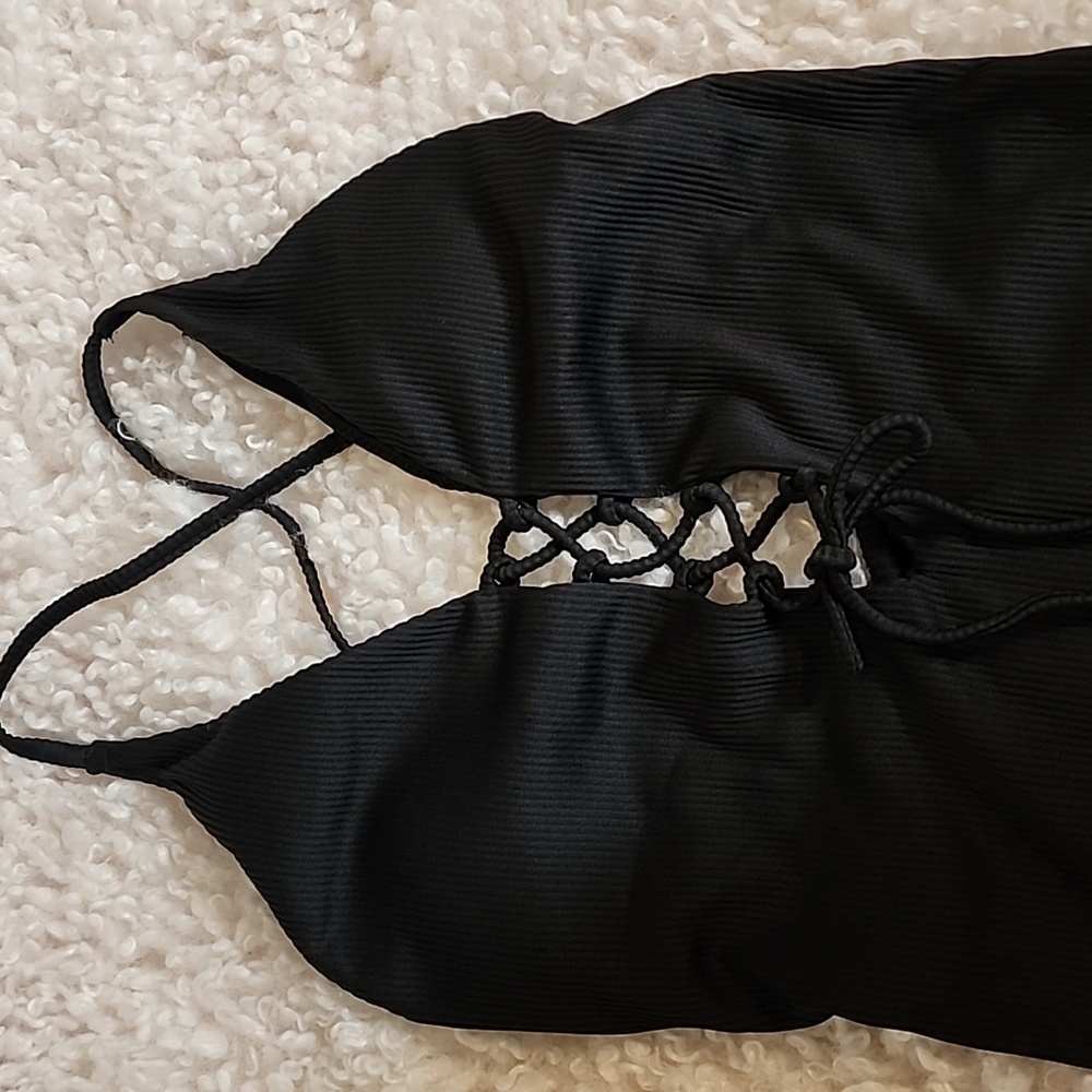 Black One Piece. Adjustable Front Details, Size Small (no Tags).